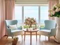 A living room with 2 wingback chairs with stained wood legs in front of a large window overlooking the ocean.