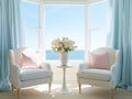 A living room with 2 wingback chairs with stained wood legs in front of a large window overlooking the ocean.