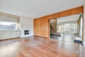 a living room with a wood floor and a fireplace Royalty Free Stock Photo