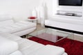 Living space with white leather couch Royalty Free Stock Photo
