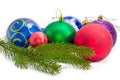 Living spruce branch against of Christmas balls at selective focus Royalty Free Stock Photo