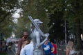 Living statue of a girl in a suit