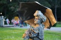 Living statue - lady with umbrella