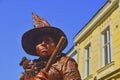 Living statue of witch. Live statue of sorceress. Living statue street performer. Living statue performers can fool passersby and