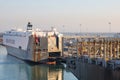 Container terminal with stowed containers from different shippers gantry cranes and straddle carriers Royalty Free Stock Photo