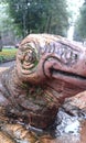 Lizzard head brown green eye statue bronze art artistic