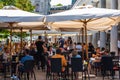 Ljubjana, Slovenia - 17 Aug, 2019 - People having lunch in packed restaurants during a hot day in the capital