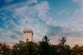 Ljubljana castle tower in sunset with beautyful clouds in the sk