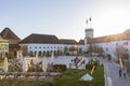 Ljubljana castle yard with lots of tourists and clock tower view