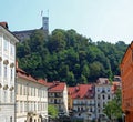 Ljubljana, L, Slovenia - August 16, 2023: Square of the city and the Tower of ancient Castle called ljubljanski grad Royalty Free Stock Photo