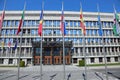 Ljubljana, L, Slovenia - August 15, 2023: Slovenian Parliament Building of the European capital and many flags