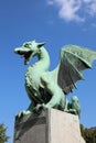 Ljubljana, L, Slovenia - August 15, 2023: Winged dragon symbol of city on the bridge called the Dragons Bridge
