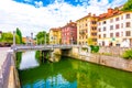 Ljubljana old town center, view of Ljubljanica river in city center. Old building historic panorama. Look to old bridge with touri