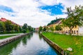 Ljubljana old town center, view of Ljubljanica river in city center. Old building historic panorama. Look to old bridge with touri