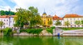 Ljubljana old town center, view of Ljubljanica river in city center. Old building historic panorama. Look to old bridge with touri