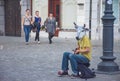 Ljubljana/Slovenia - April 28, 2018: funny street artist singing and wearing a cow head mask