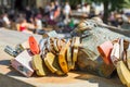 Ljubljana, Slovenia - August 16, 2018: A frog sculpture by slovene artist Jakov Brdar covered by tourists' love padlocks