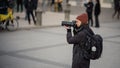 LJUBLJANA, SLOVENIA, 2.3.2022: Female photographer documenting anti war protests in support of ukraine against russian opression Royalty Free Stock Photo