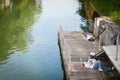 Lovers, couples of young adults, lying down on the riverbank of Ljubljanica, in the city center of Ljubljana, sleeping, having a n