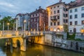 LJUBLJANA, SLOVENIA - MAY 13, 2019: Riverside buildings and the Cobblers bridge in Ljubljana, Sloven Royalty Free Stock Photo