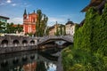 Ljubljana, Slovenia - Tromostovje bridge and Franciscan Church of the Annunciation with Ljubljanica river in the city centre Royalty Free Stock Photo