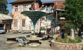 Ljubljana, Slovenia - 07/19/2015 - View of Metelkova, artistic district with colored buildings, graffitti, sculptures and mosaics Royalty Free Stock Photo