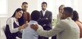 People in group therapy, friends, or colleagues trying to comfort and support sad woman Royalty Free Stock Photo