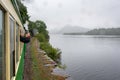 Llanberis Lake and Snowdonia mountains in the light rain seen from slow moving steam train - 1