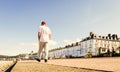 Tourist strolling on Llandudno Promenade Noth Wales Royalty Free Stock Photo