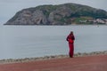 Buddhist monk enjoying an evening walk on the promenade