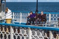 Llandudno , Wales - April 23 2018 : Folks enjoying the Pier at the seaside resort of Llandudno, North Wales, United Royalty Free Stock Photo