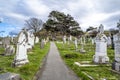 Llandudno , Wales, UK - April 22 2018 : Dramtic graves standing at St Tudno`s church and cemetery on the Great Orme at