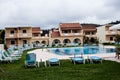 LLandudno, Wales, UK - MAY 27, 2018 Beautiful and glamorous Blue Swimming Pool next to the gorgeus green grass. Quiet Water surrou