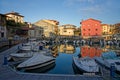 Port of Llanes and old houses at sunset