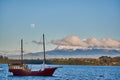 The Llanquihue lake with the magnificent Calbuco volcano and the moon. View from Puerto Varas near Puerto Montt, Chile Royalty Free Stock Photo