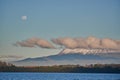 The Llanquihue lake with the magnificent Calbuco volcano and the moon. View from Puerto Varas near Puerto Montt, Chile