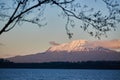 The Llanquihue lake with the magnificent Calbuco volcano and the moon. View from Puerto Varas near Puerto Montt, Chile Royalty Free Stock Photo