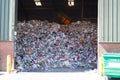 Llarge pile of colored paper waste at the waste recycling plant