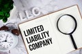 LLC - Limited Liability Company acronym on notepad, Business concept background Royalty Free Stock Photo