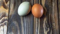 Llight blue and brown eggs. Easter Festival concepts. Araucana egg and the egg of an ordinary chicken Royalty Free Stock Photo