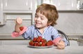 Llittle boy with strawberry