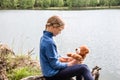 Llittle cute girl play with teddy bear on summer outdoors. Friend Concept