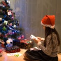 Llittle girl is unpacking presents Royalty Free Stock Photo