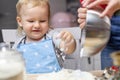 LLttle cute boy playing with flour in the kitchen Royalty Free Stock Photo