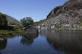 Llyn Ogwen, Ogwen lake, with building on the shore in Snowdonia National Park, North Wales.