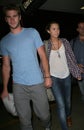 LMiley Cyrus & boyfriend Liam Hemsworth at LAX