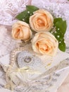 Wedding image with tea roses and pearl necklace Royalty Free Stock Photo