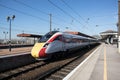 LNER Azuma train on a platform waiting to depart. Empty Platform with blue sky