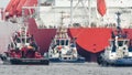 LNG TANKER AND TUGBOATS Royalty Free Stock Photo