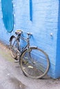 Lnodon, U.K. July 22, 20121: stylish retro blue bicycle isolated on blue wall background, city ride